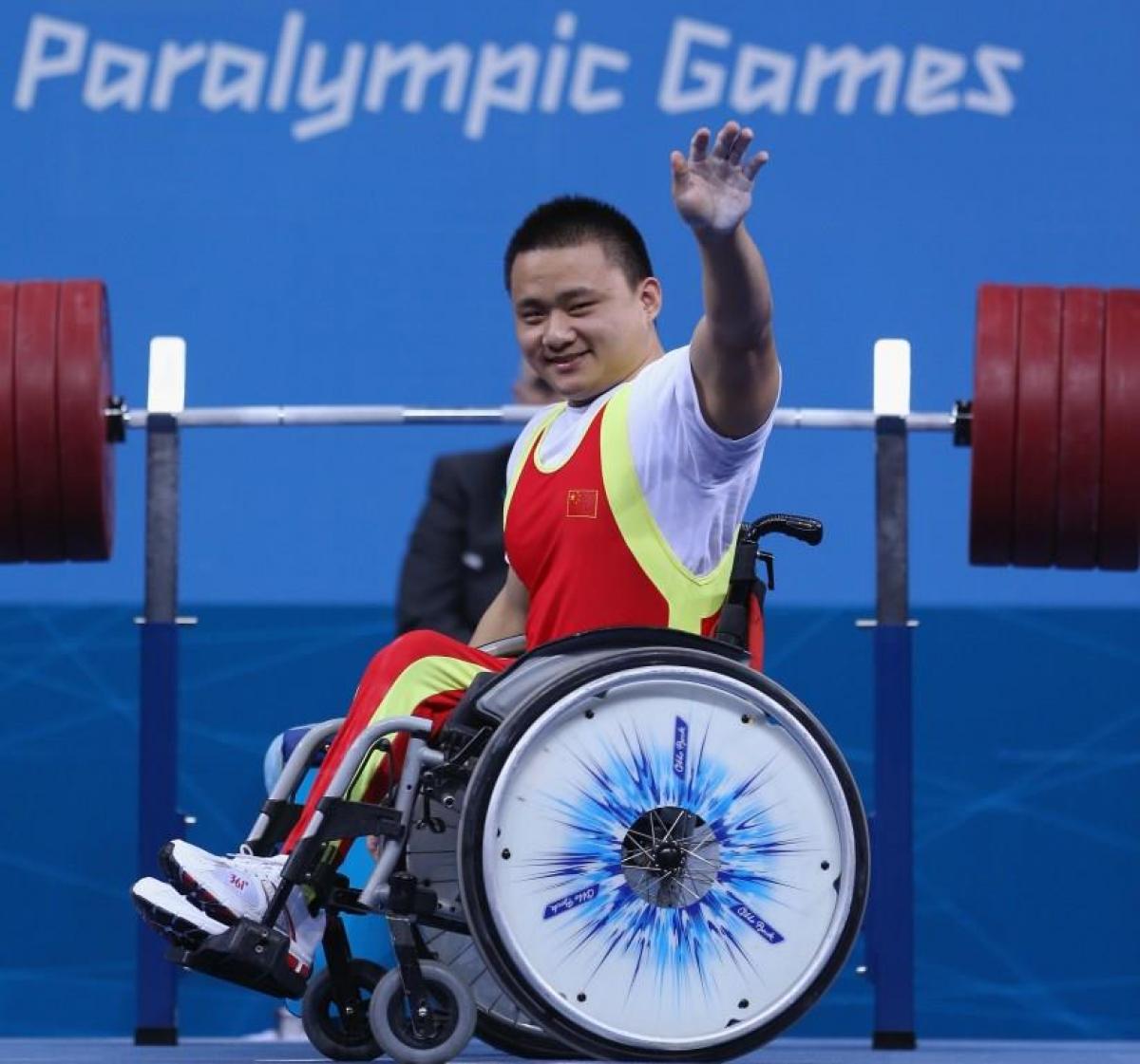 Liu Lei of China celebrates a world record lift and takes gold in the Men's 67.5kg competition at the London 2012 Paralympic Games.