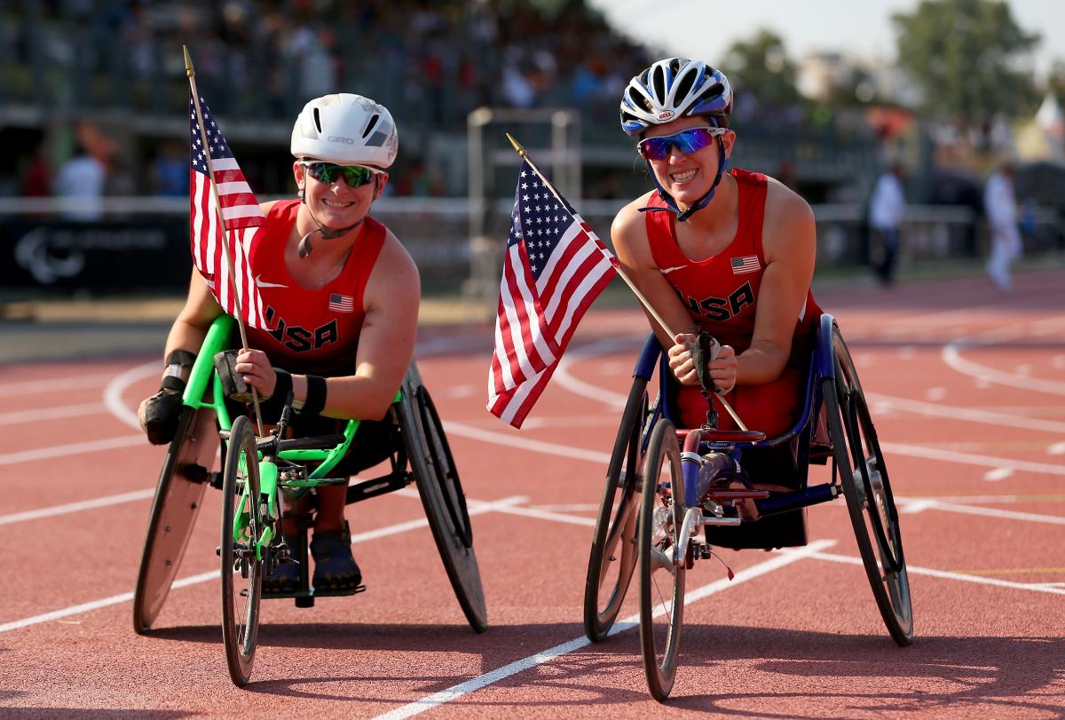 Cassie Mitchell and Kerry Morgan of the USA after the women's 100m T52 final at the 2013 IPC Athletics World Championships in Lyon, France.