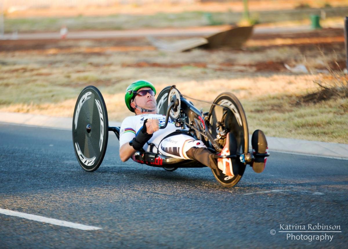 Man in a handbike on a road