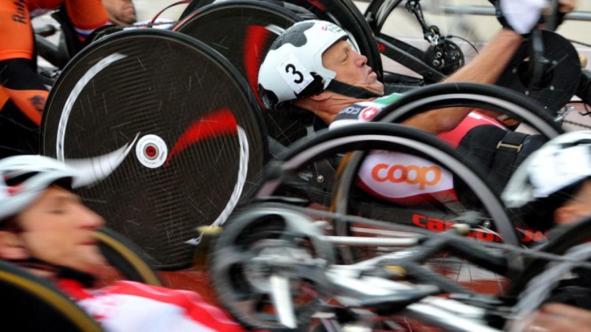 Several hand cyclists at the start of a race