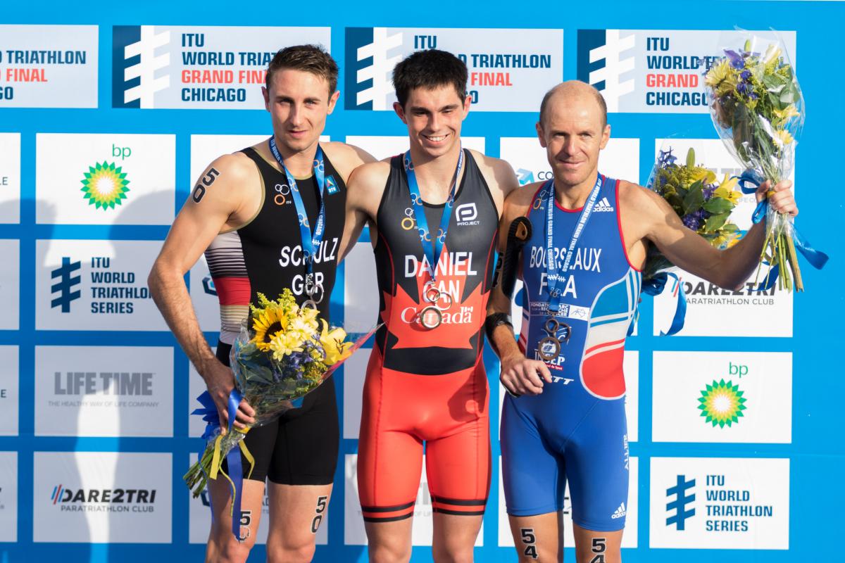 Podium with three men