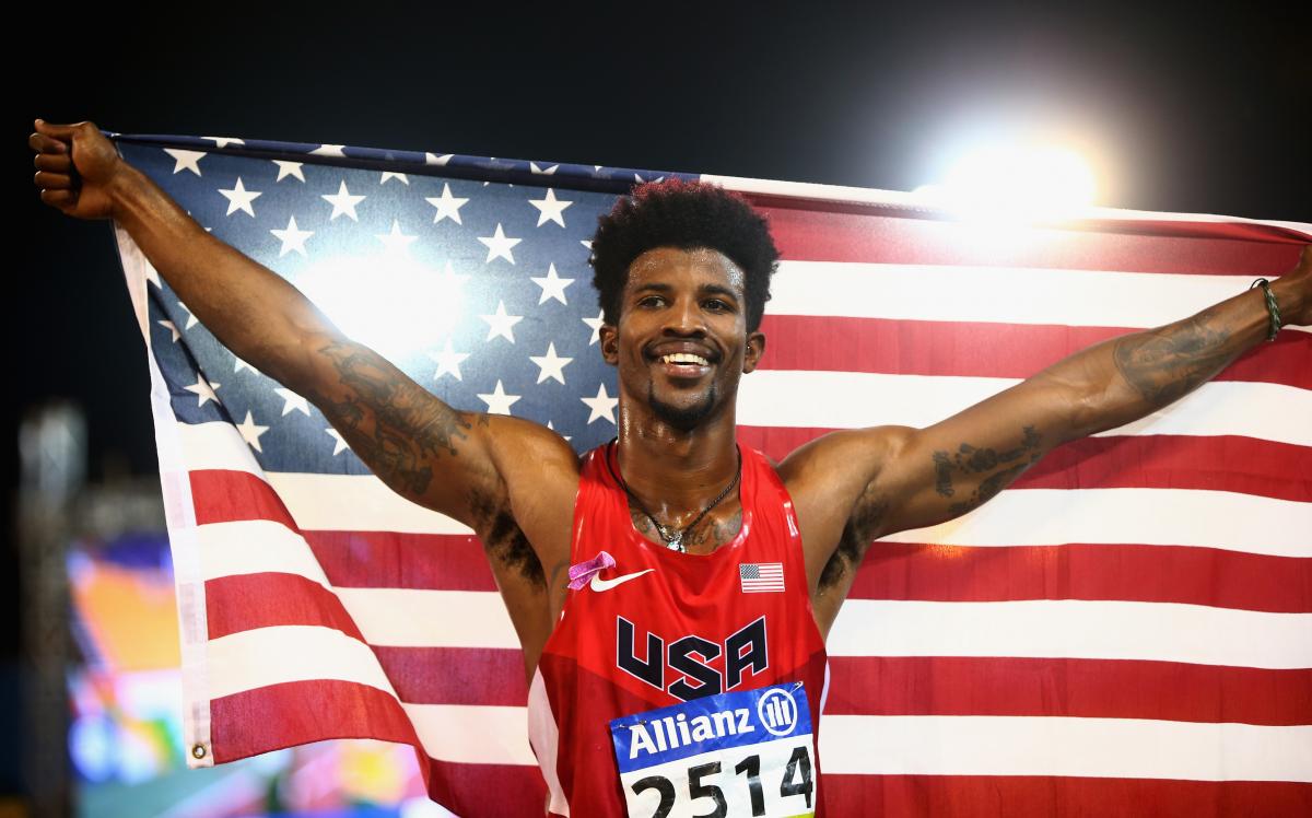 Man holding up an American flag