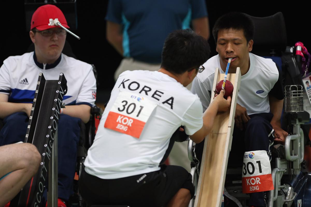 2 men playing Boccia