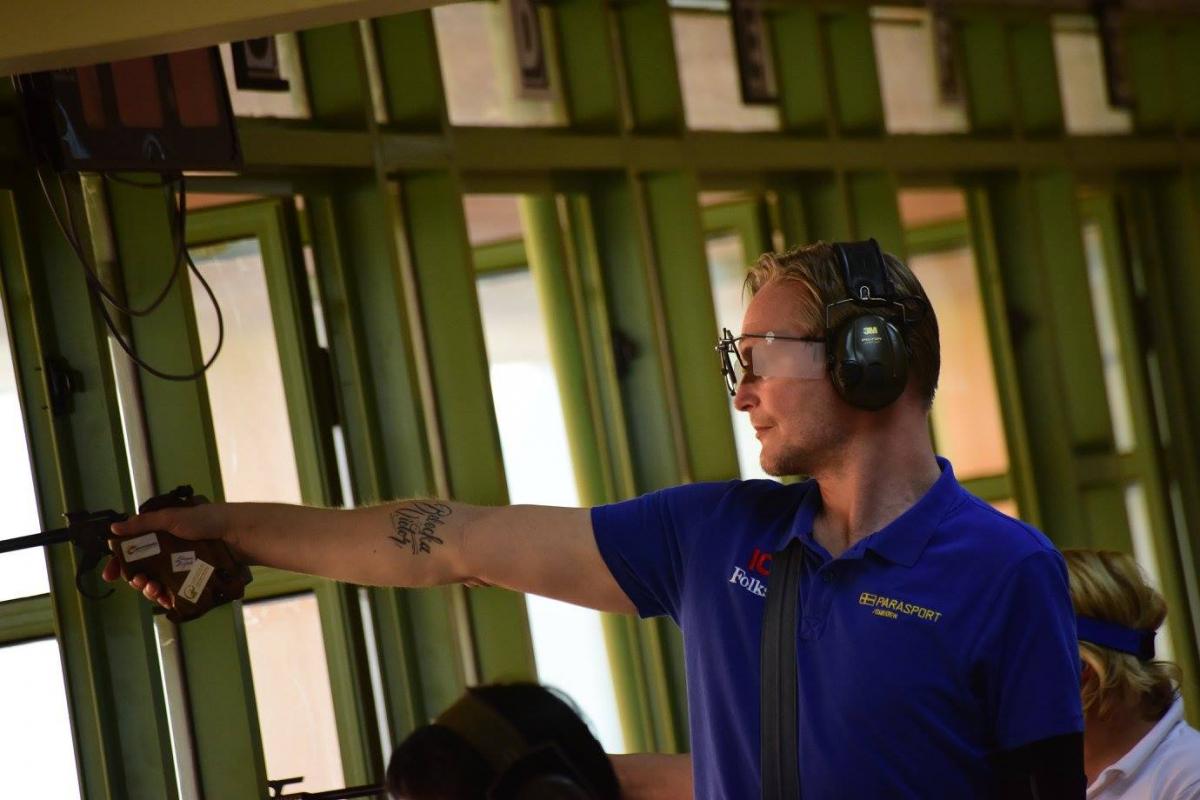 A man shooting a pistol