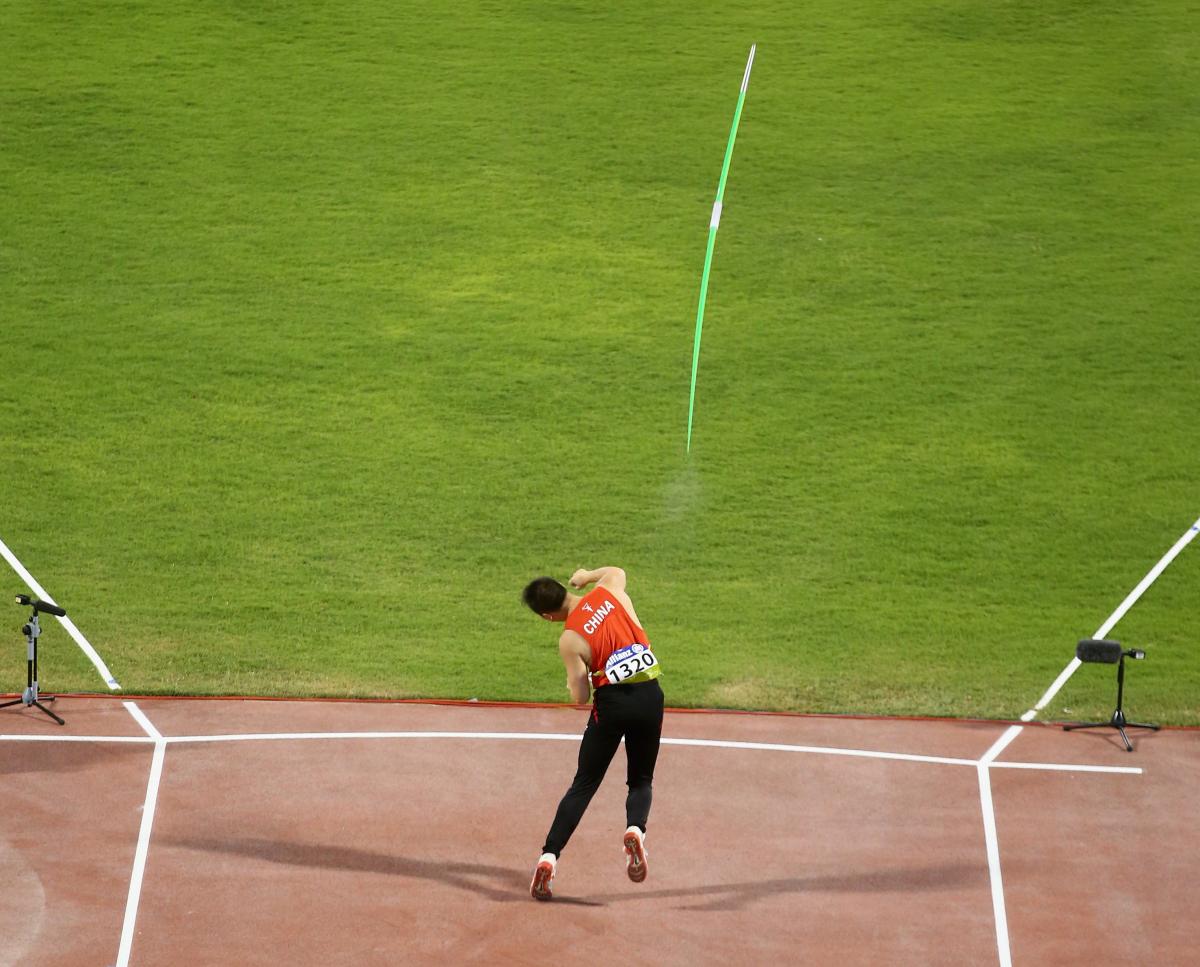 A para-athlete throws a javelin