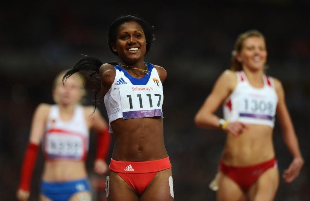 Yunidis Castillo of Cuba celebrates as she wins gold in the Women's 100m T46 Final at the London 2012 Paralympic Games.