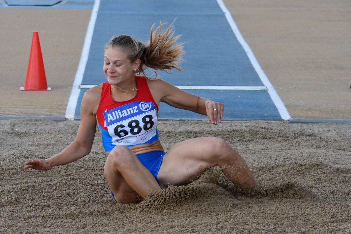 Woman lands in the sand pit 