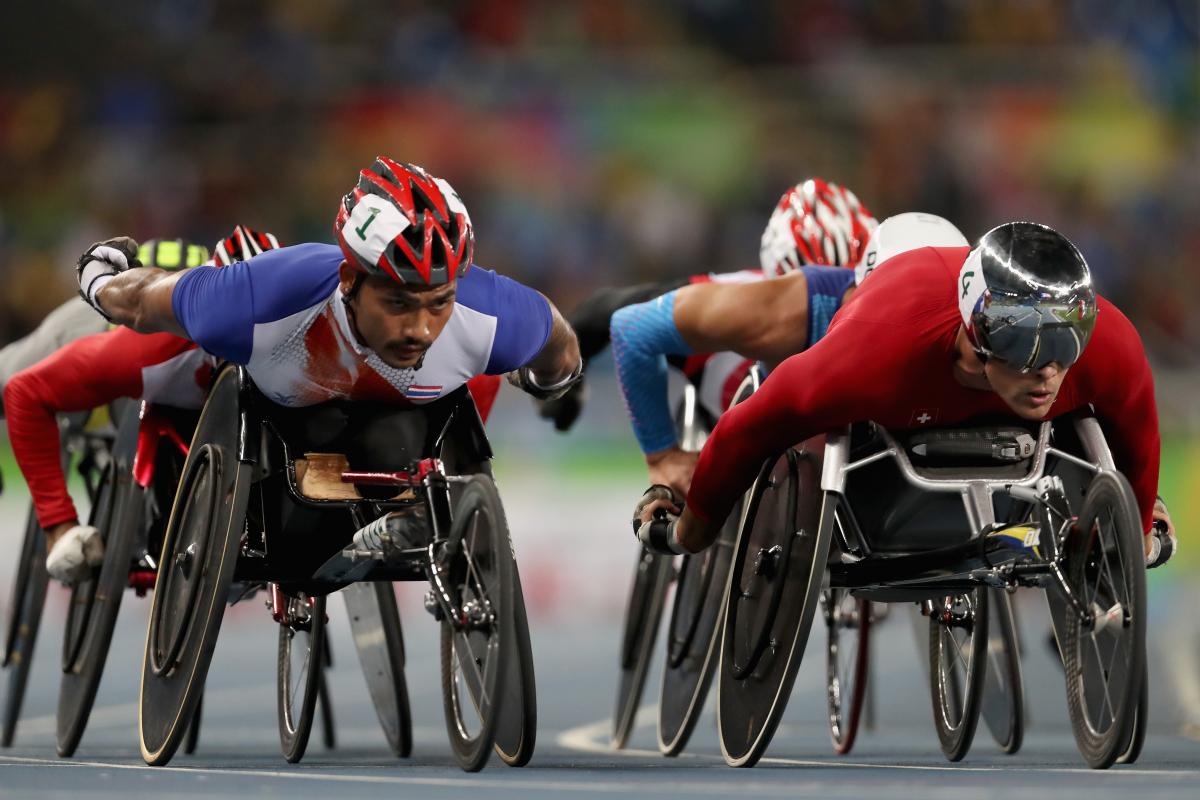 Prawat Wahoram of Thailand and Marcel Hug of Switzerland lead the pack in heat one of the men's 5000m meter T54 at the Rio 2016 Paralympic Games.