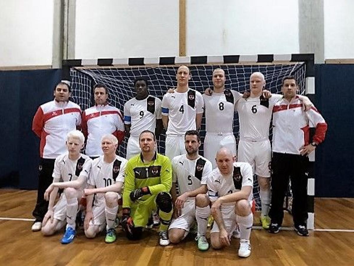 Team photo of men in white jerseys