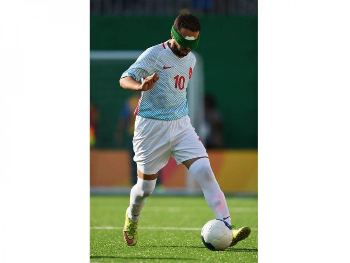 Celal Coban of Turkey runs with the ball in the men's football 5-a-side during the Rio 2016 Paralympic Games.