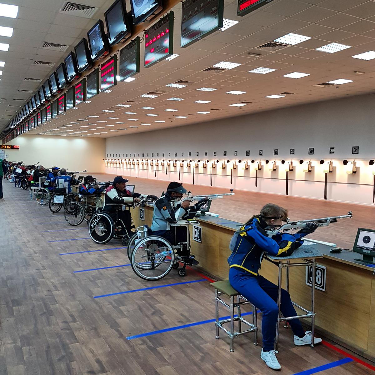 Shooting range with athletes in action