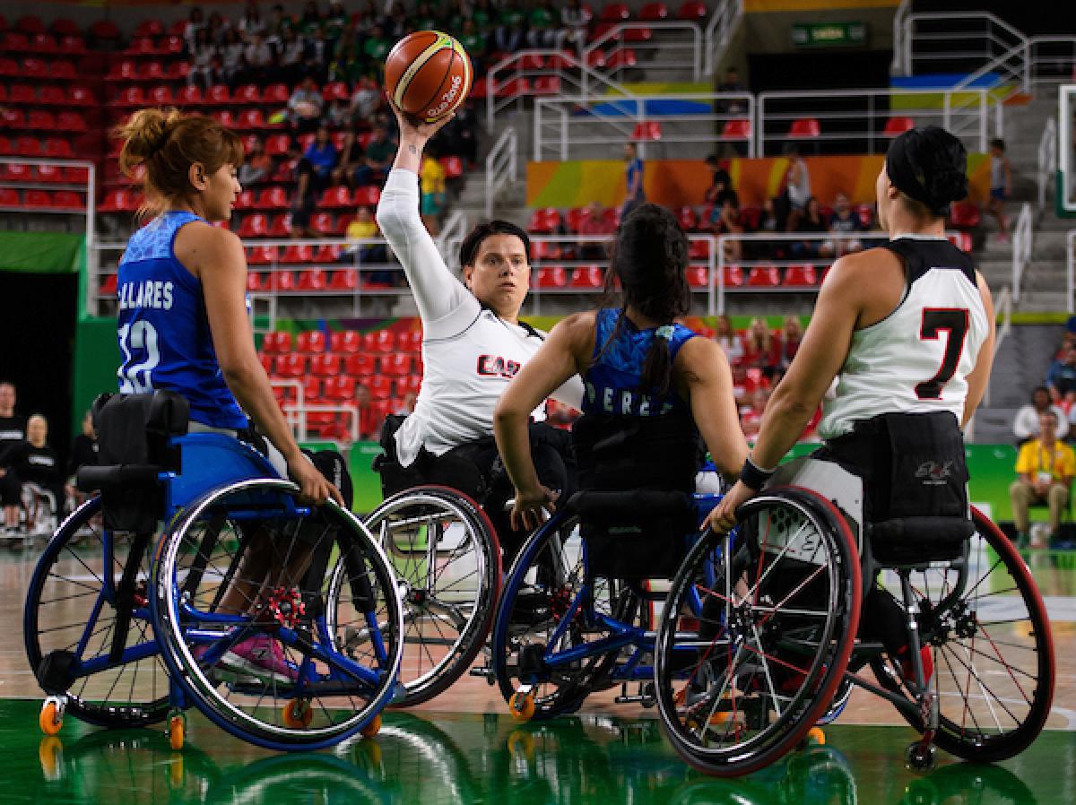 Woman shooting a basketball