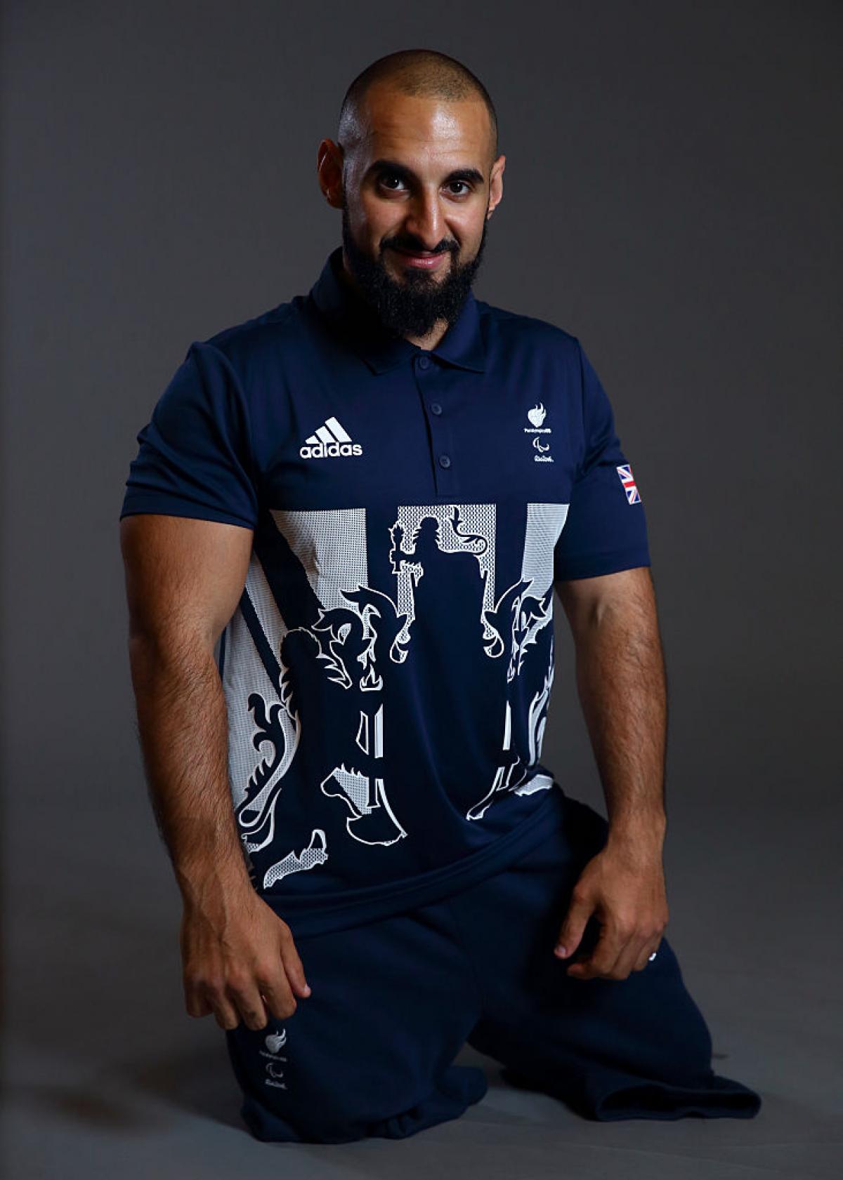 Great Britain's Ali Jawad smiles for the camera at a photocall in London