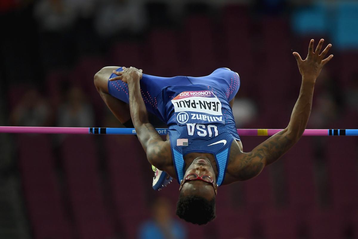 A man mid-leap in the high jump clearing the bar