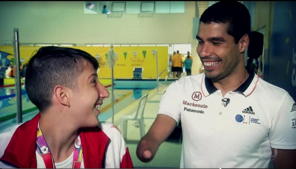 Man and a teenage boy smiling