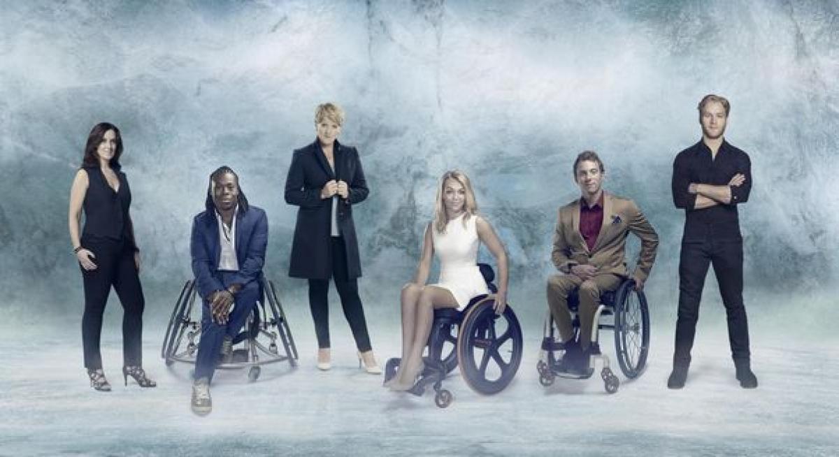 five TV presenters standing in front of a winter backdrop