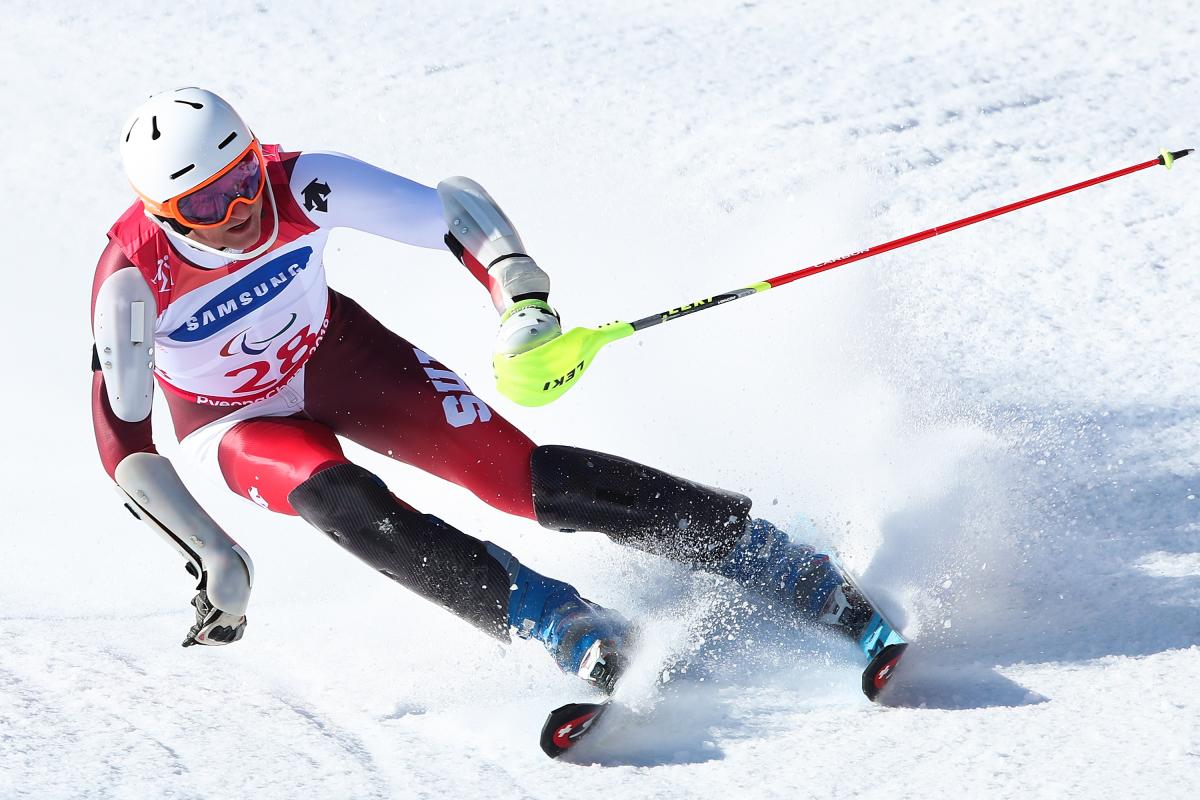 a male Para alpine skier in action