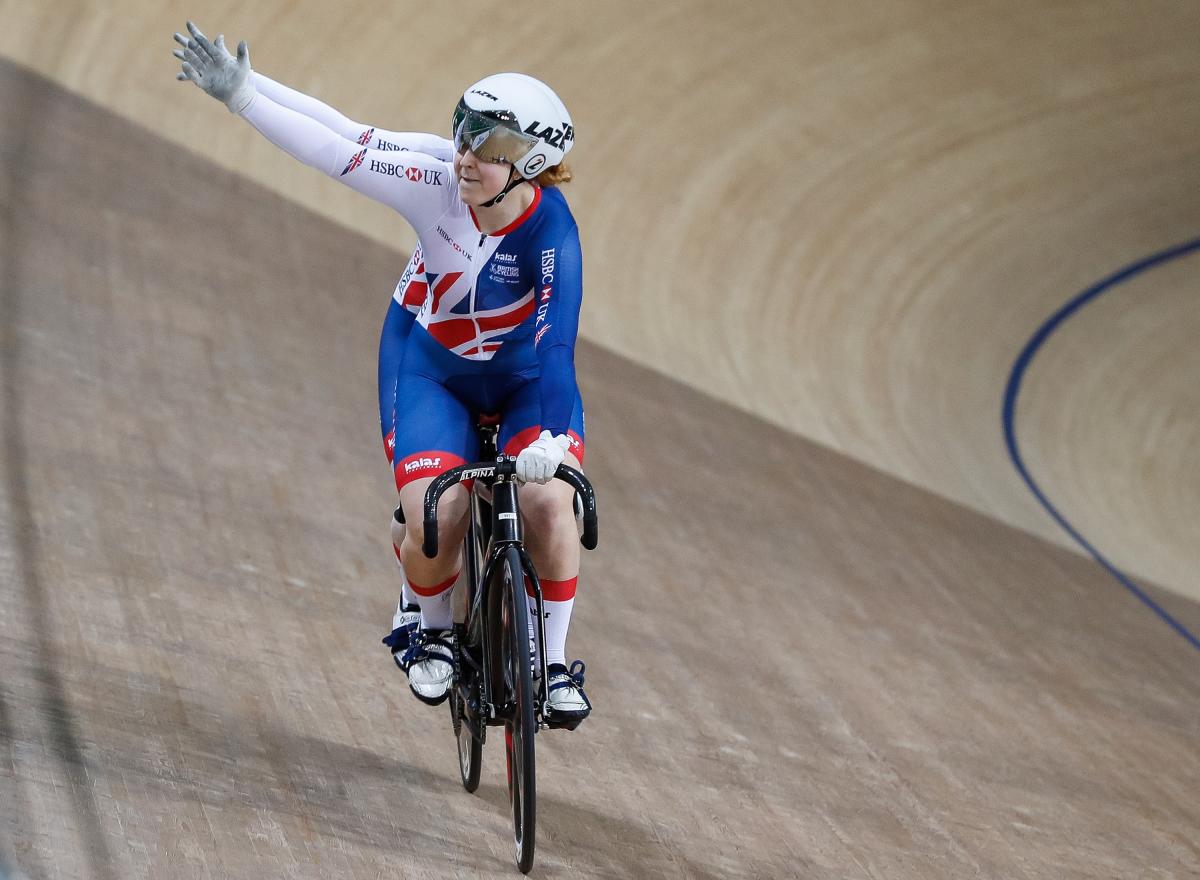 a female tandem team celebrate winning a race