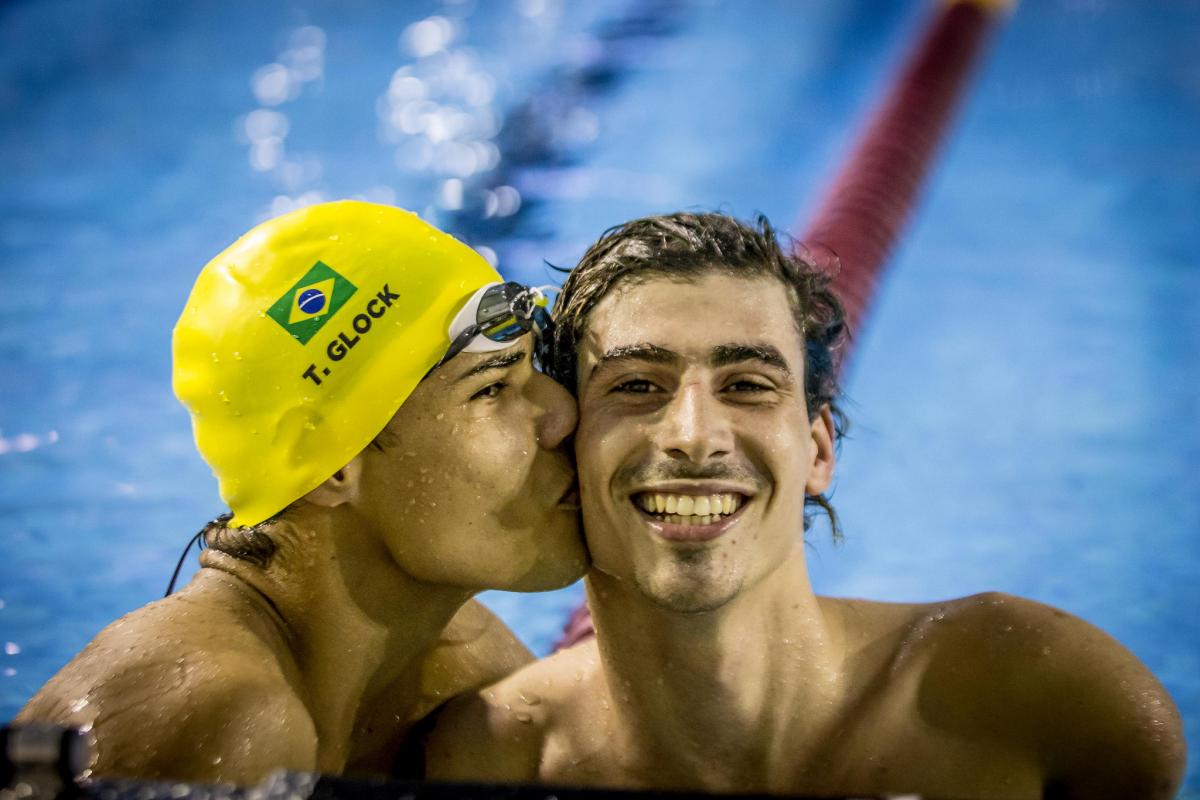 Talisson Glock - Sao Paulo 2018 one male swimmer kissing another on the cheek in celebration