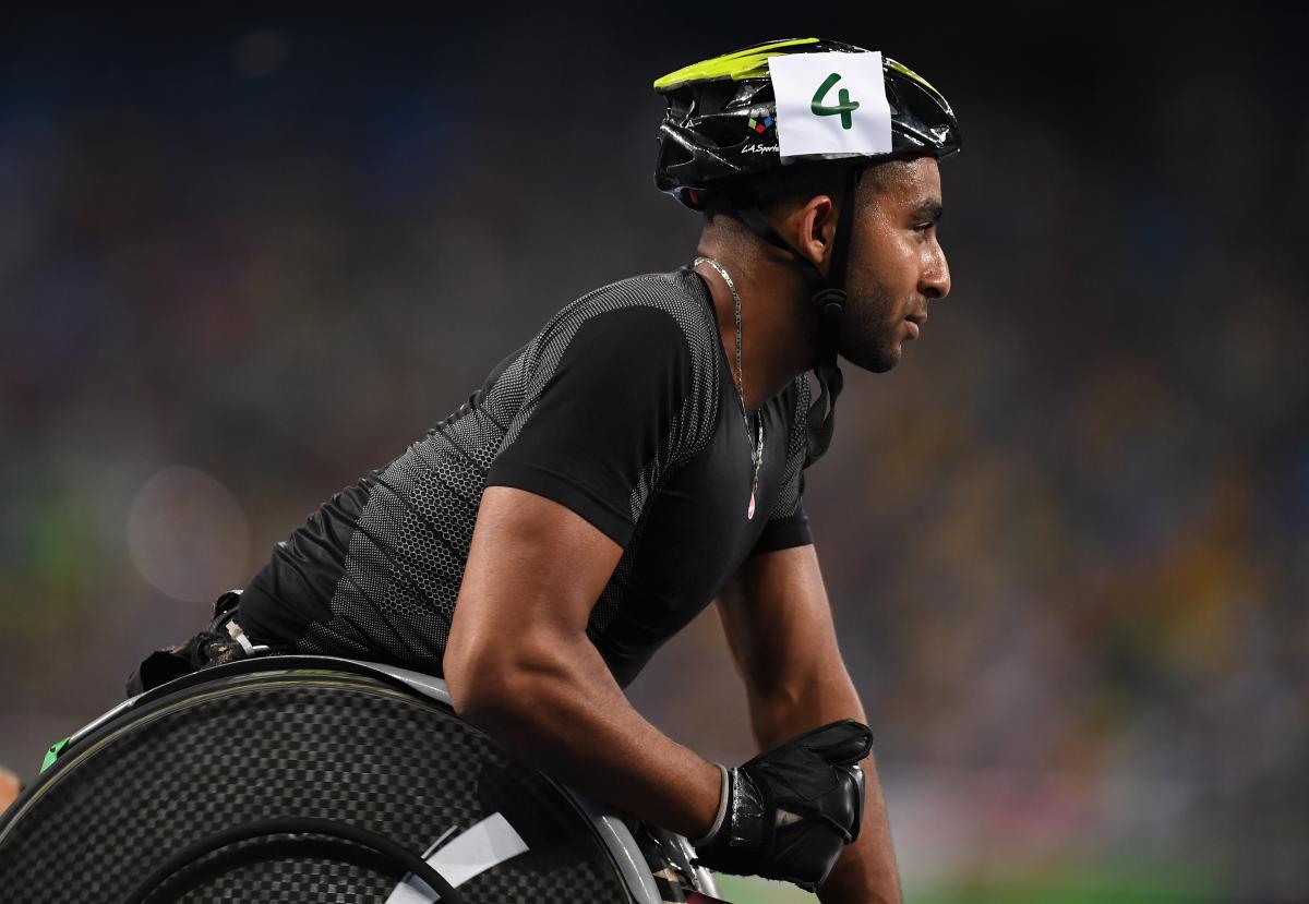 a male wheelchair athlete at the end of the race