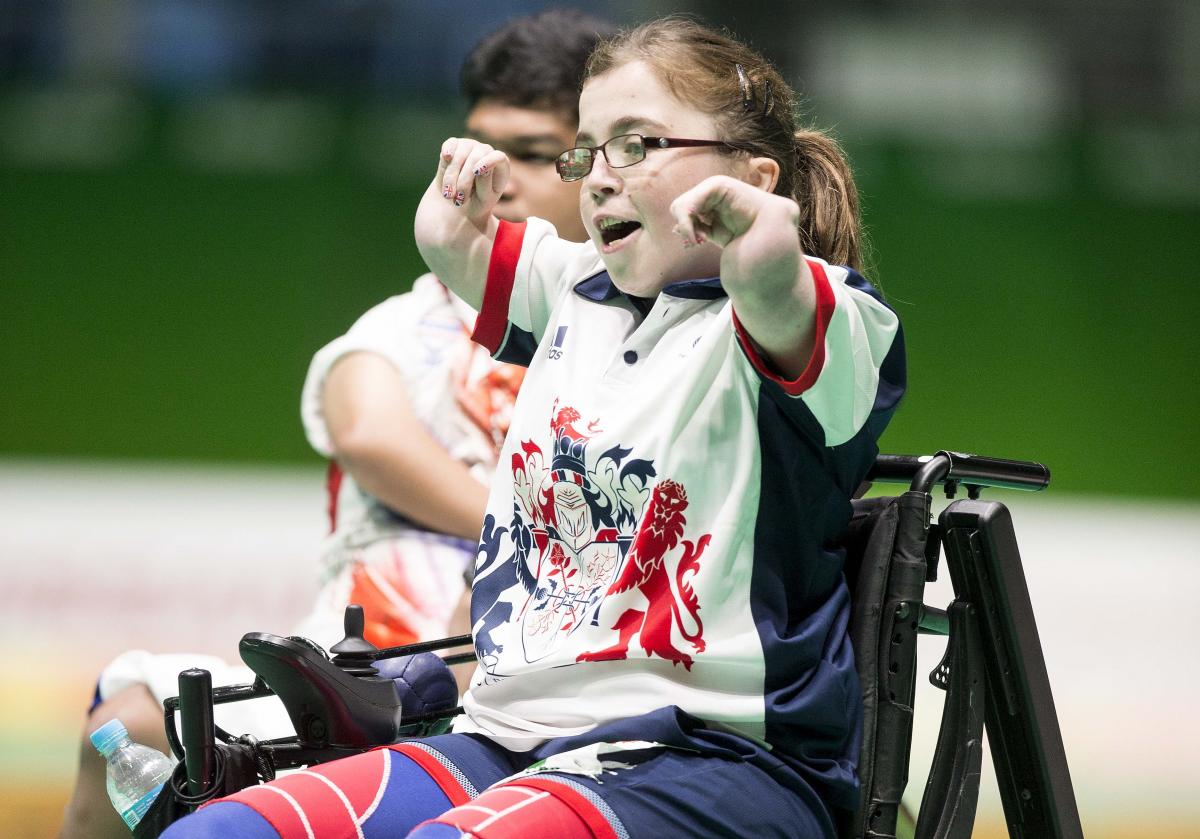 a female boccia player celebrates