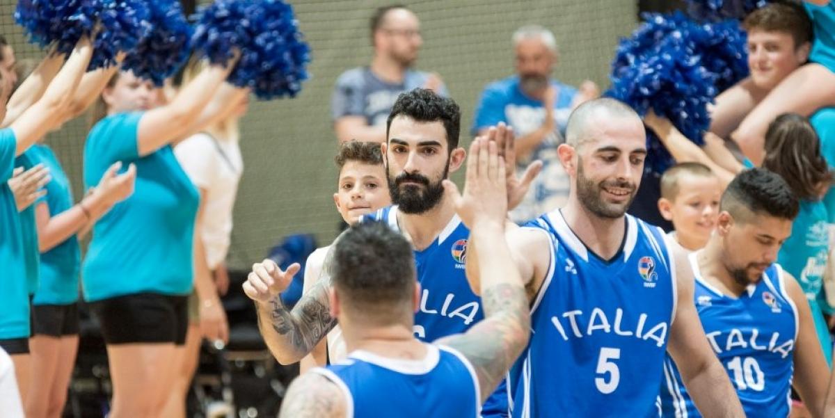 a group of male wheelchair basketballers on court