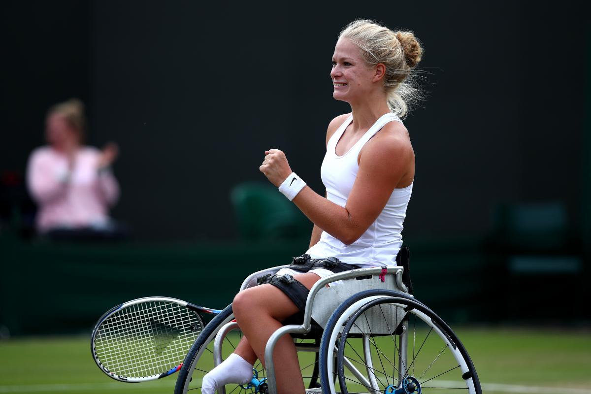 female wheelchair tennis player Diede de Groot plays a shot on grass