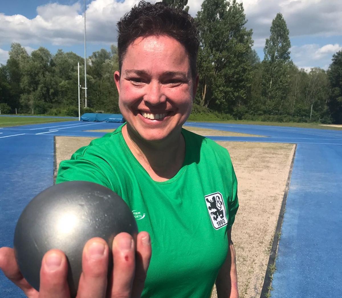 Birgit Kober female Para athlete Birgit Kober smiling and holding a shot put