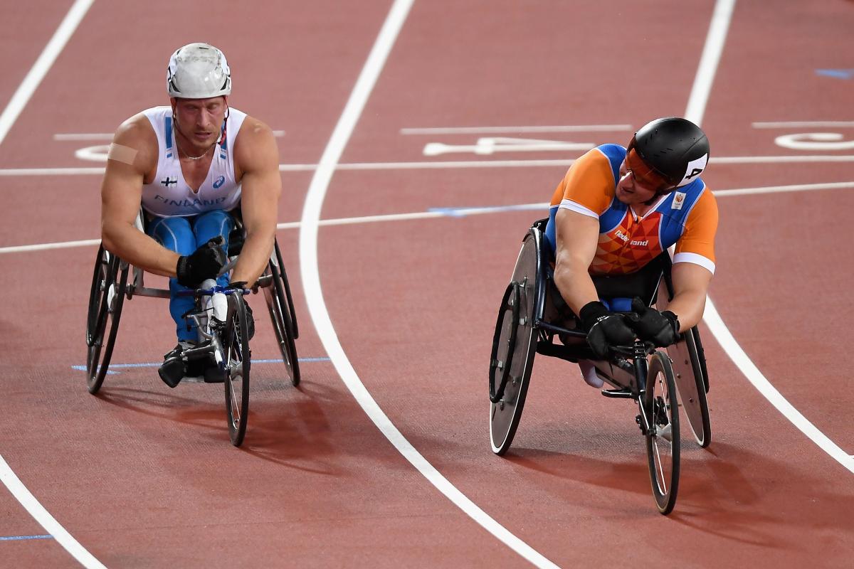 two male wheelchair racers, Leo Pekka Tahti and Kenny van Weeghel, line up on the start line