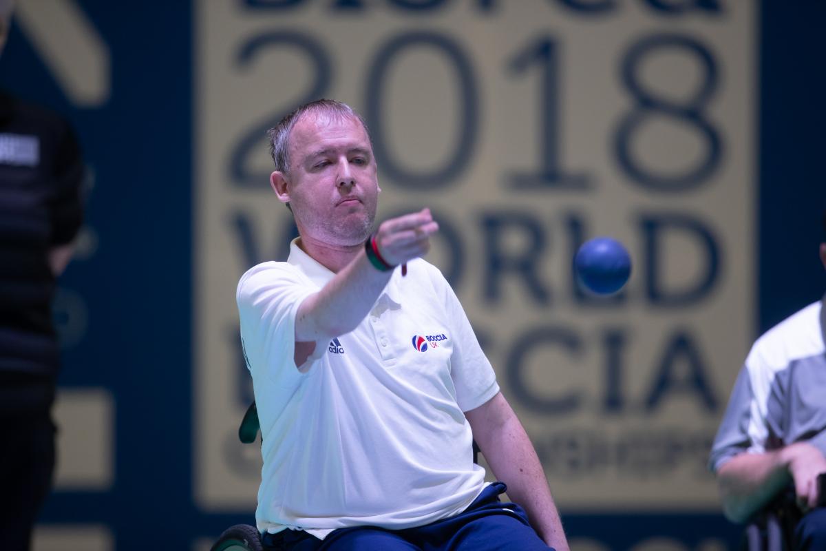 male boccia player Stephen McGuire takes a shot