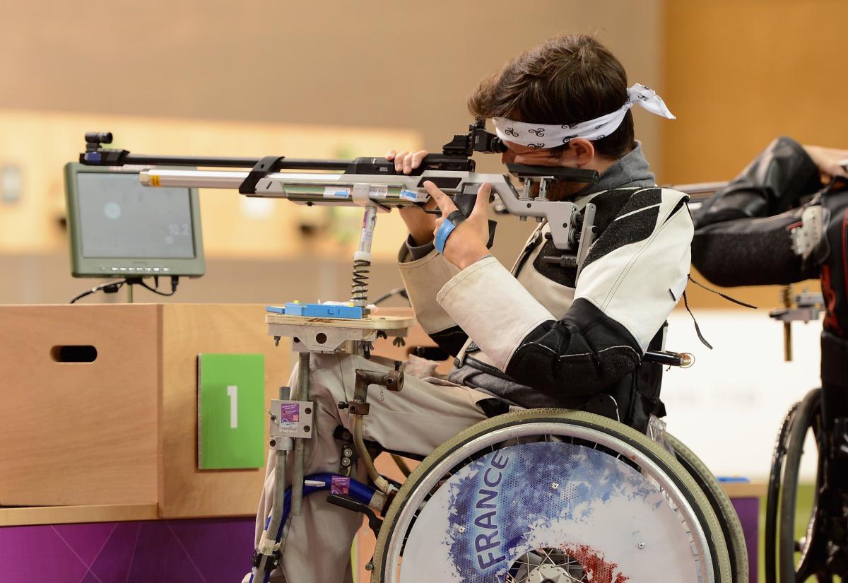 Man in a wheelchair shooting a rifle