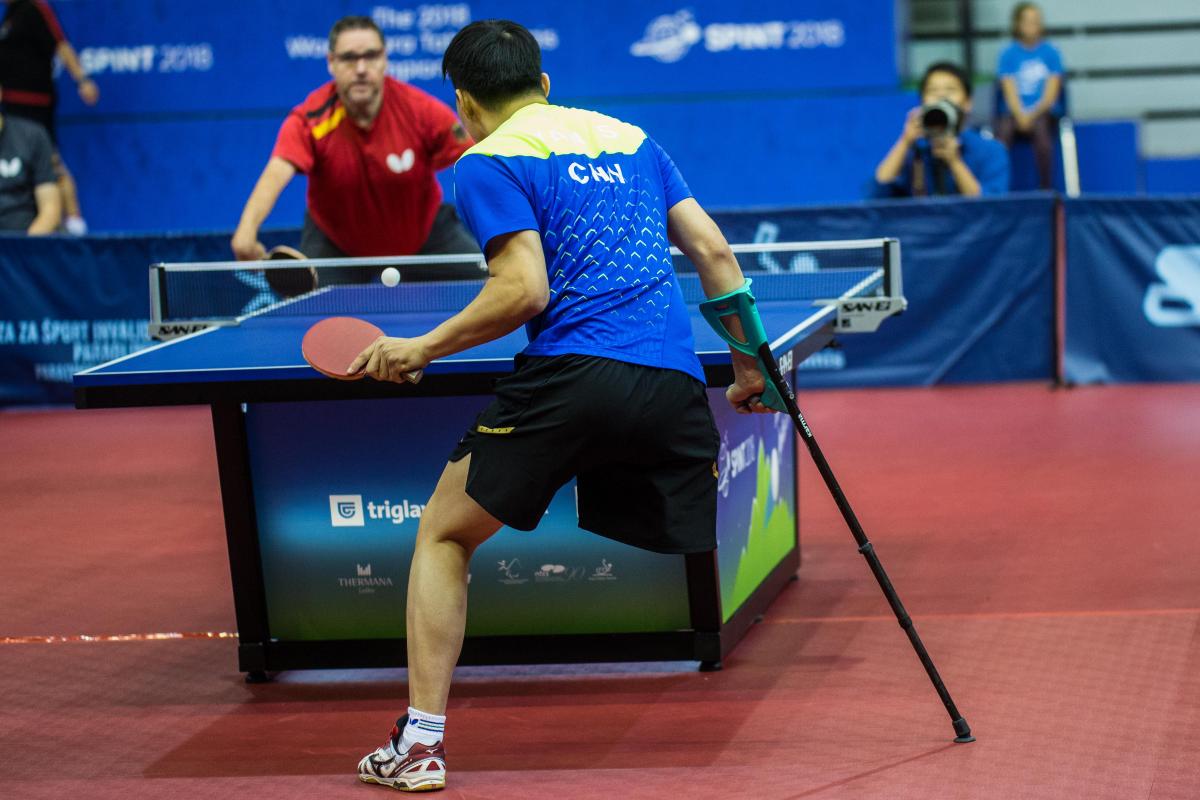 male Para table tennis player Yan Shuo plays a forehand