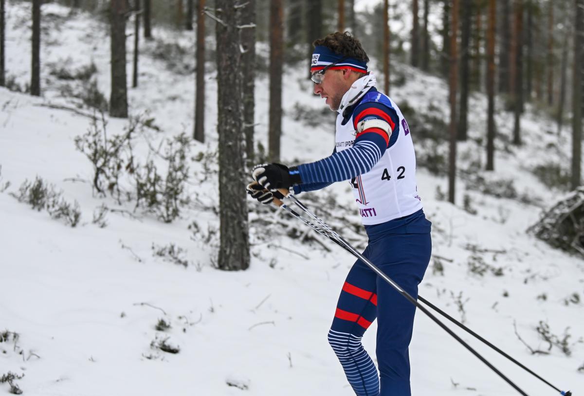 male Para Nordic skier Benjamin Daviet pushes through the snow