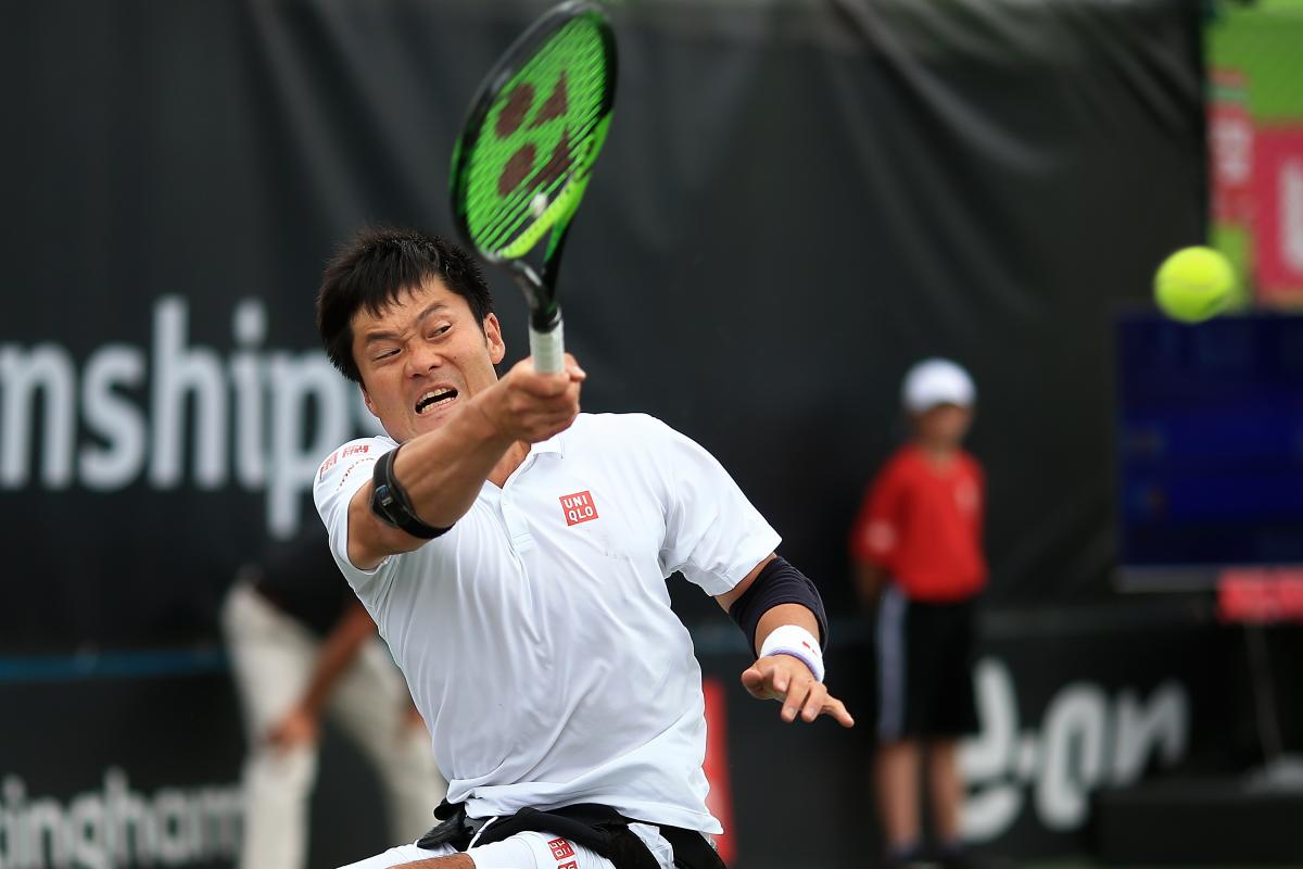 male wheelchair tennis player Shingo Kunieda hits a backhand