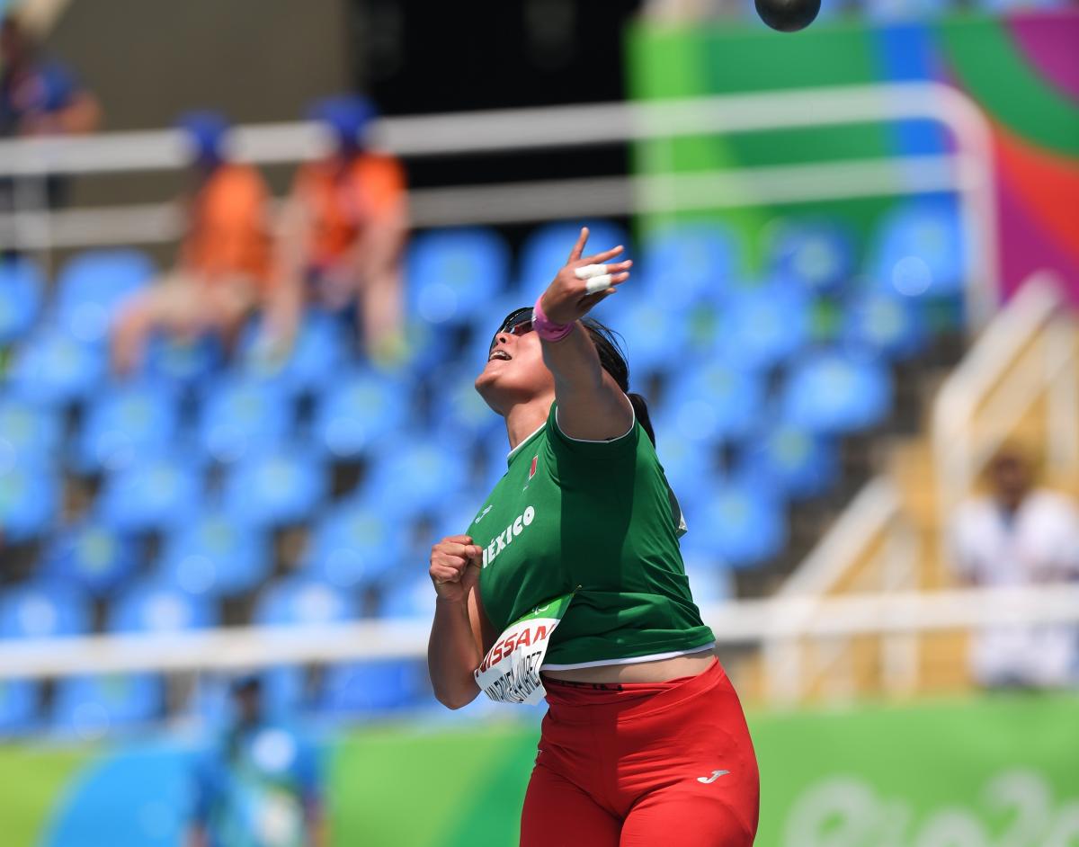 female Para athlete Rebeca Valenzuela Alvarez throws the shot put