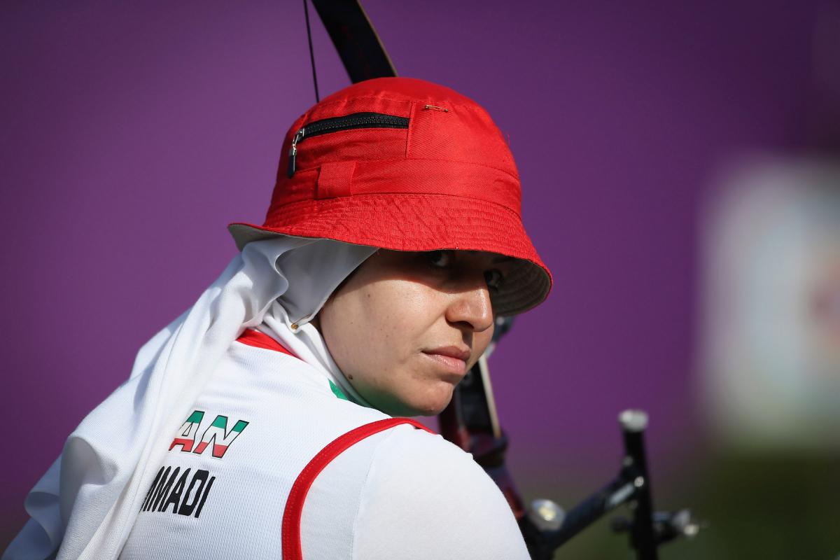 A female archer with a red hat