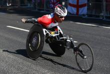 A picture of a man in a wheelchair during an athletics race